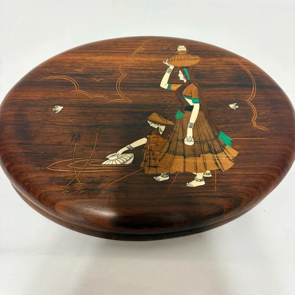 Vintage Indian rosewood wall art plaques with intricate bone inlay designs.